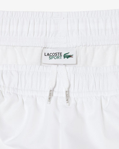 pantalón corto blanco lacoste con cintura elástica y diseño clásico